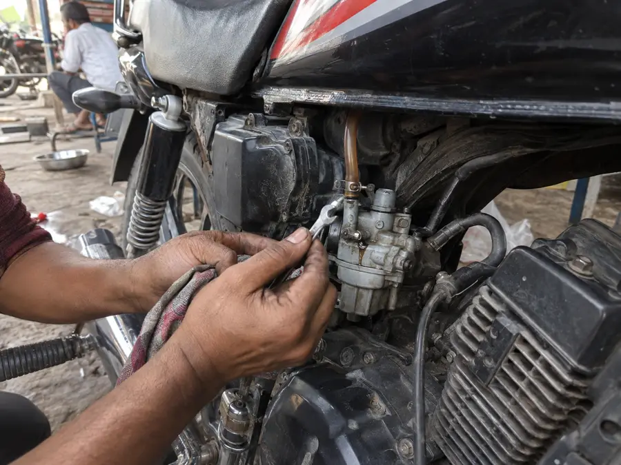 Bike carburetor and fuel line repair at Kundli workshop