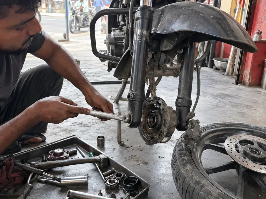 Bike suspension and wheel bearing repair at Sonipat workshop